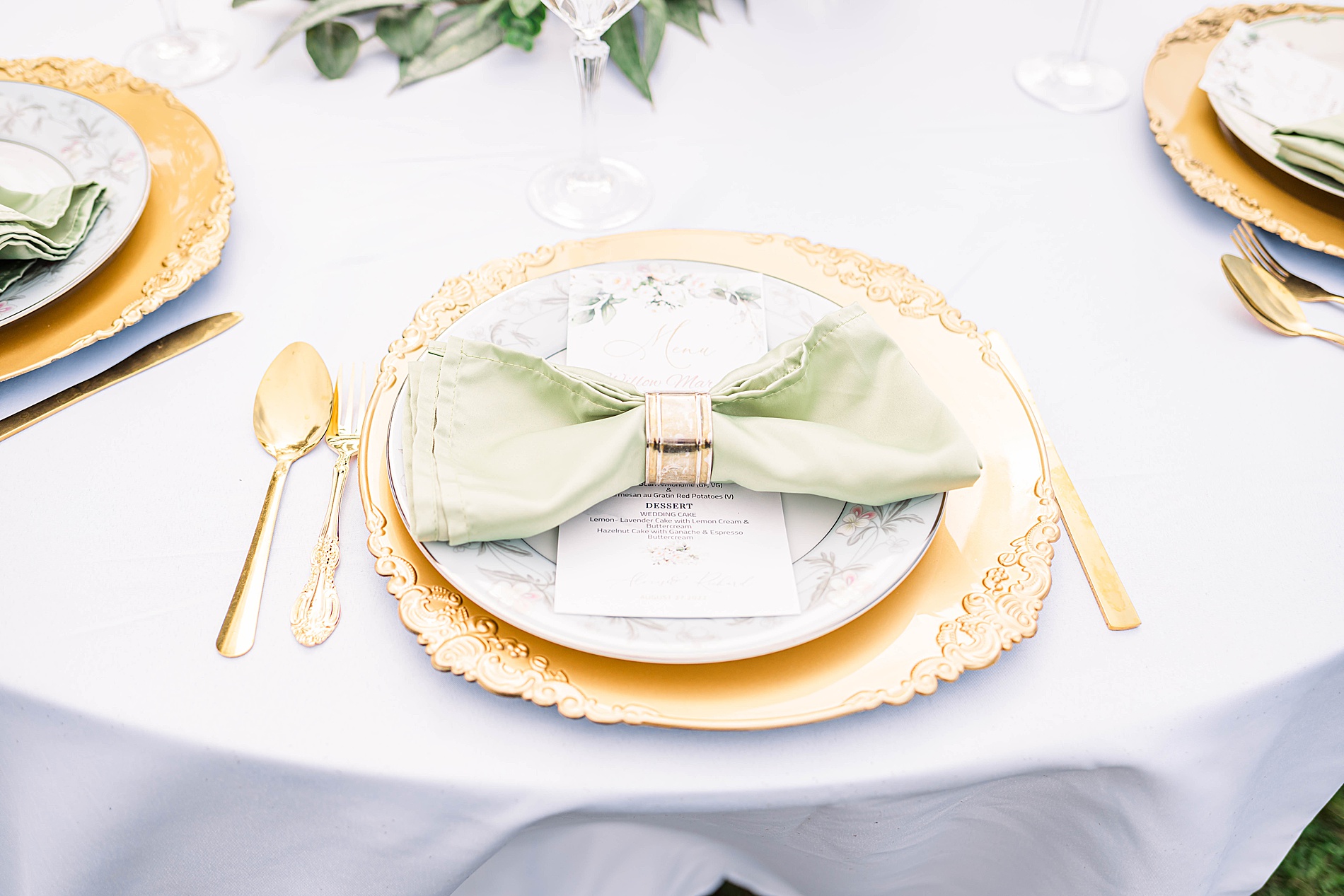 gold plates and cutlery from wedding reception in Salem, OR at Legacy Estate Vineyard  