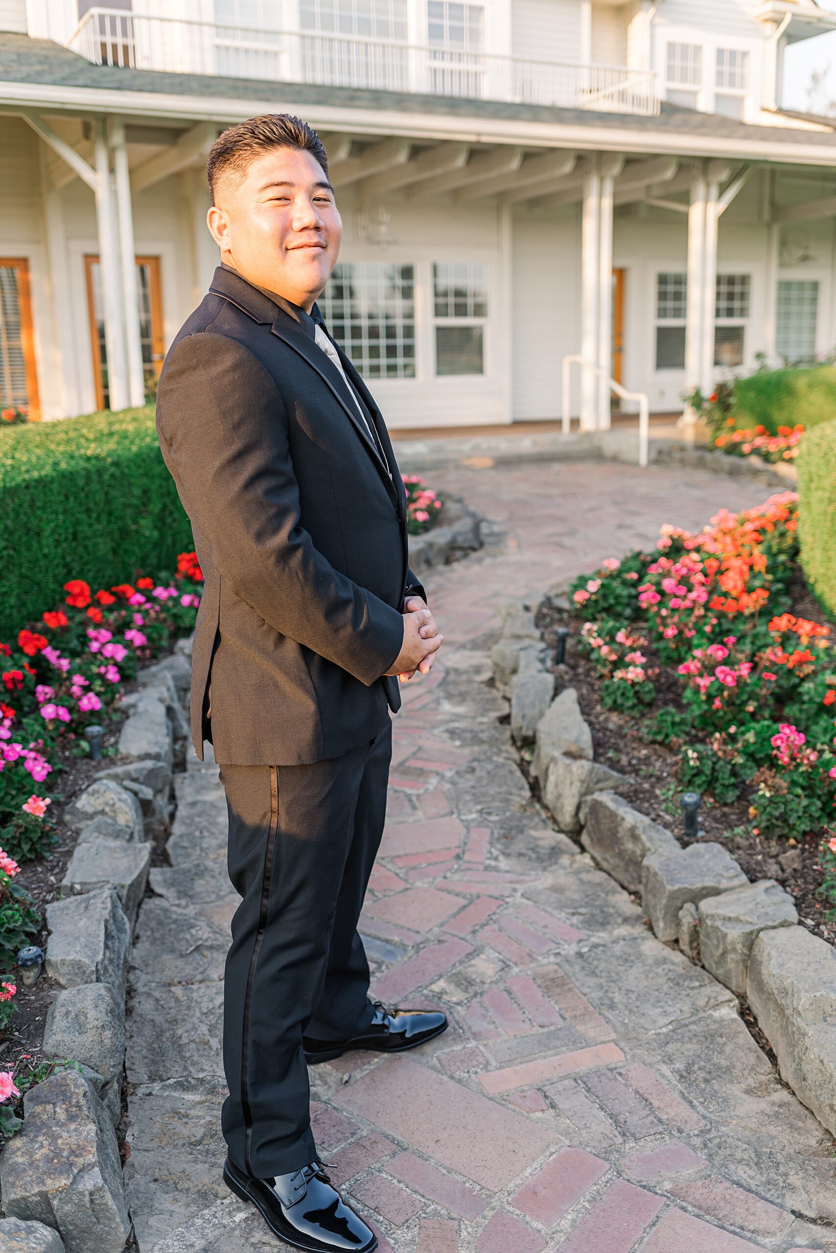 groom outside of Langdon Farms Golf Club before first look 