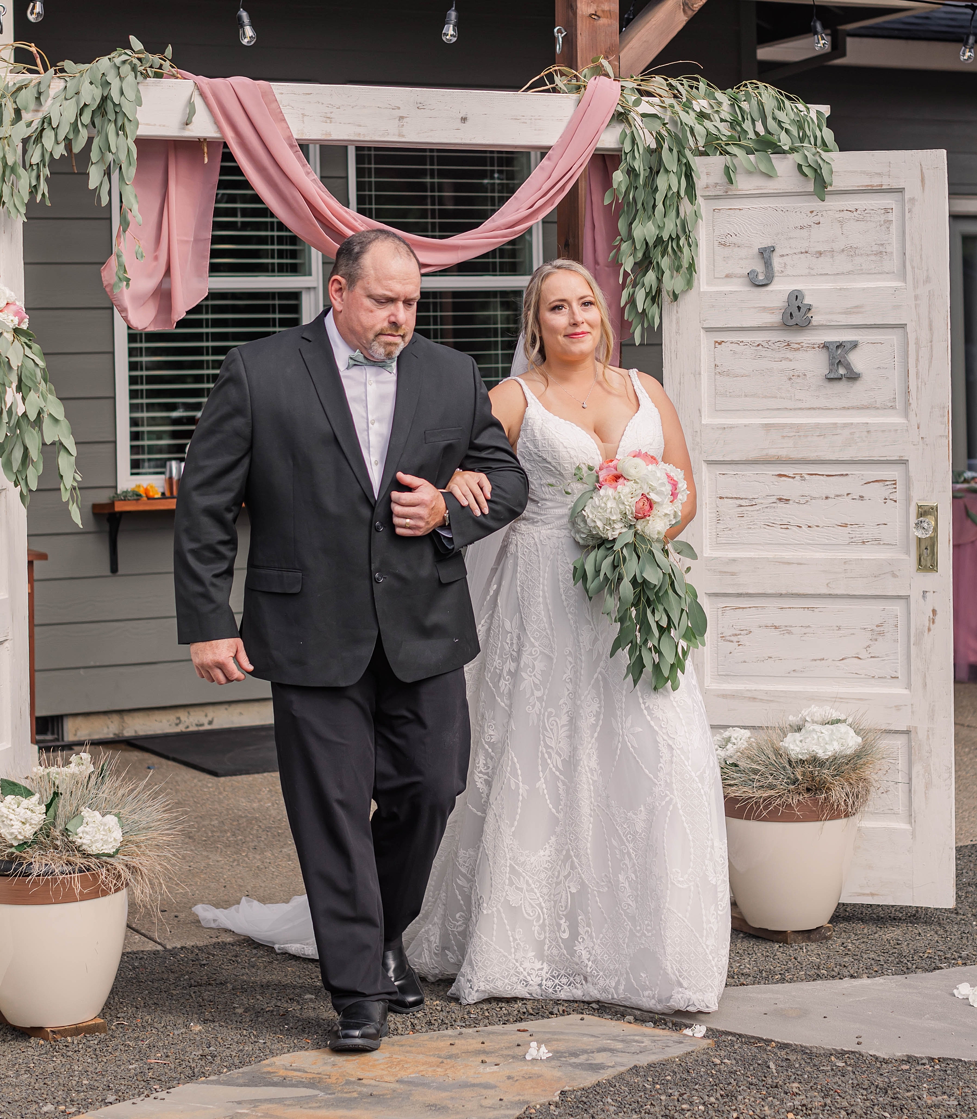 bride walks with father at Intimate Backyard Oregon Wedding ceremony